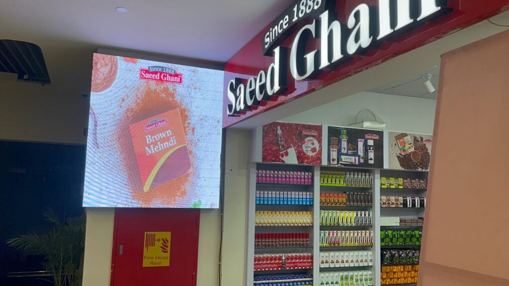 LED display screen advertising a brand named as Eaeed Ghani on the enterance of their store.