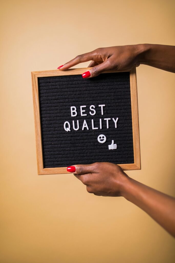 A picture of a board while having a text of best Quality on it .